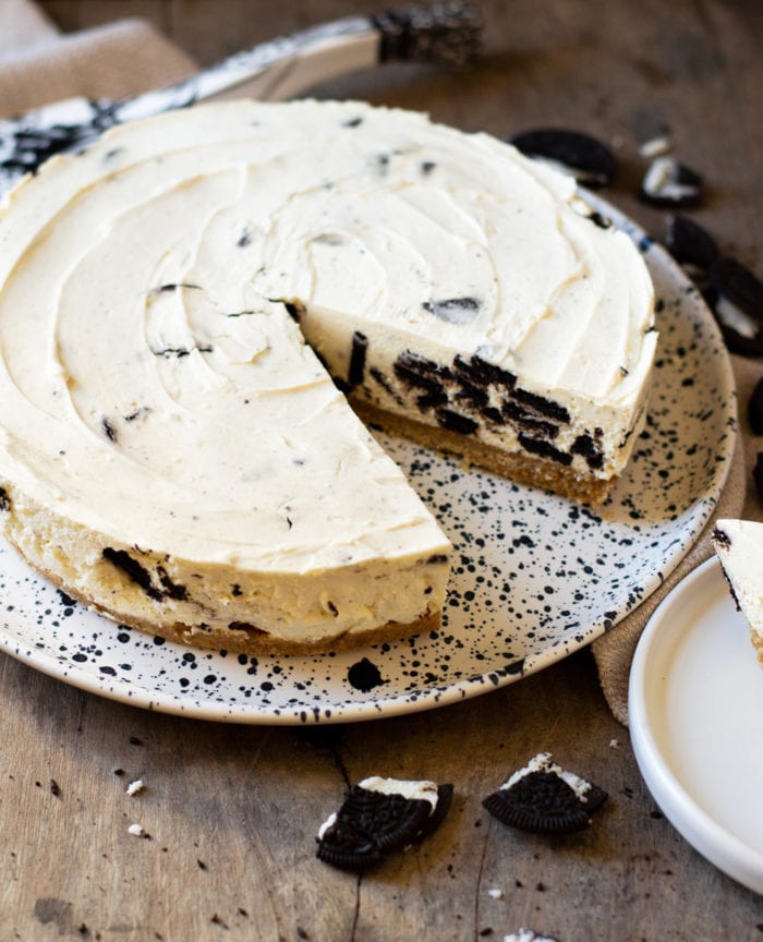 photo of an Oreo Cheesecake with a piece removed