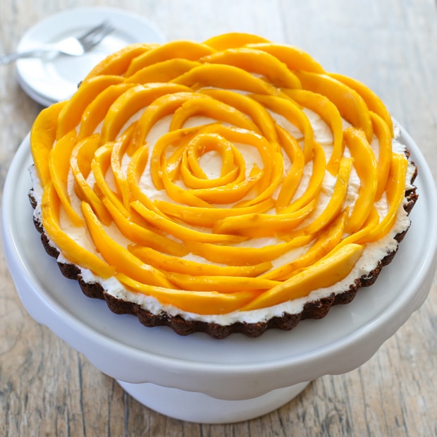 photo of a Mango Coconut Tart on a cake stand