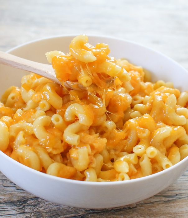 photo of a bowl of macaroni and cheese with a spoon