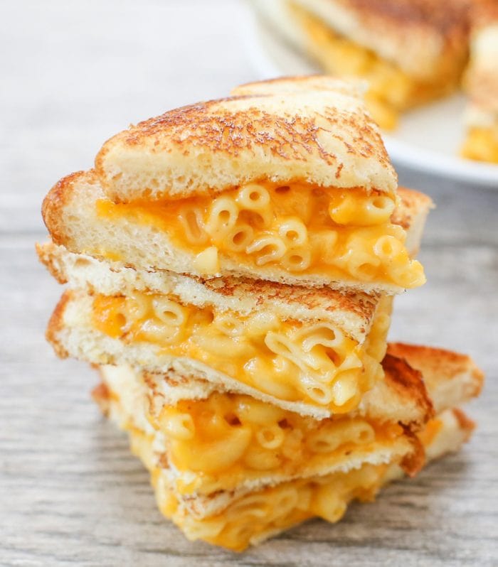 a close up photo of grilled macaroni and cheese sandwiches