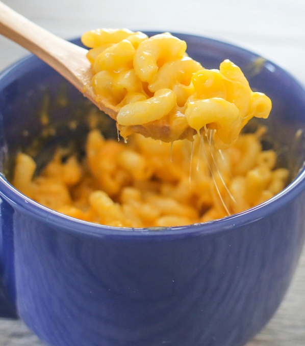 a close-up photo of a spoonful of macaroni and cheese