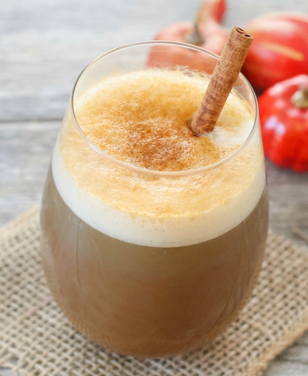close-up photo of a glass of Pumpkin Spice Frappuccino garnished with a cinnamon stick