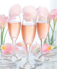 photo of glasses of champagne topped with cotton candy