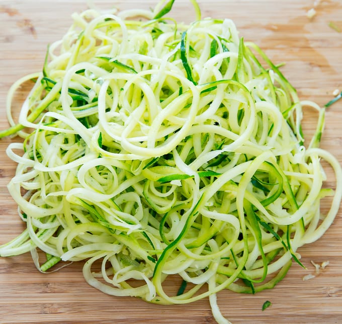 step by step photo showing spiralized zucchini noodles