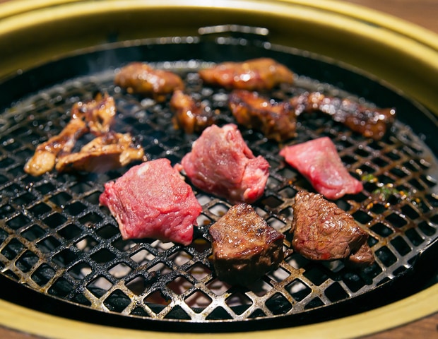 photo of meat cooking on a BBQ