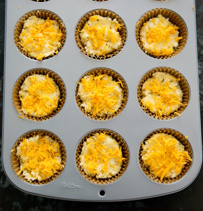 process photo of cauliflower batter in muffin tin lined with cupcake liners