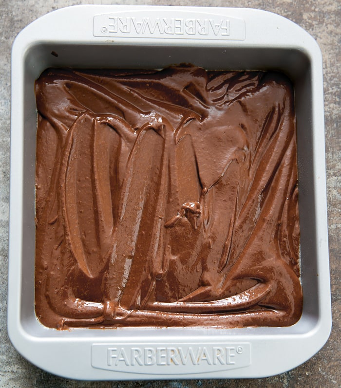 overhead photo of Brownies batter in a baking pan
