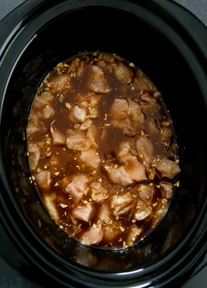 overhead photo of the chicken and sauce in the slow cooker
