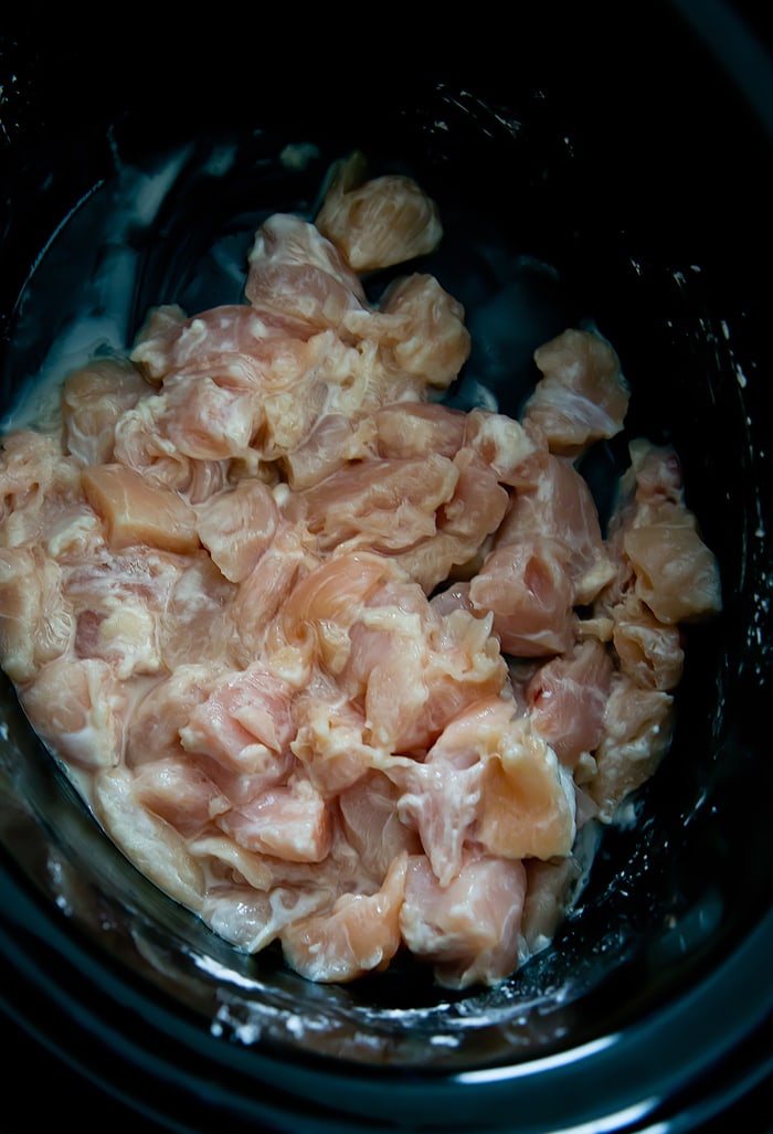 process photo showing the chicken in the slow cooker
