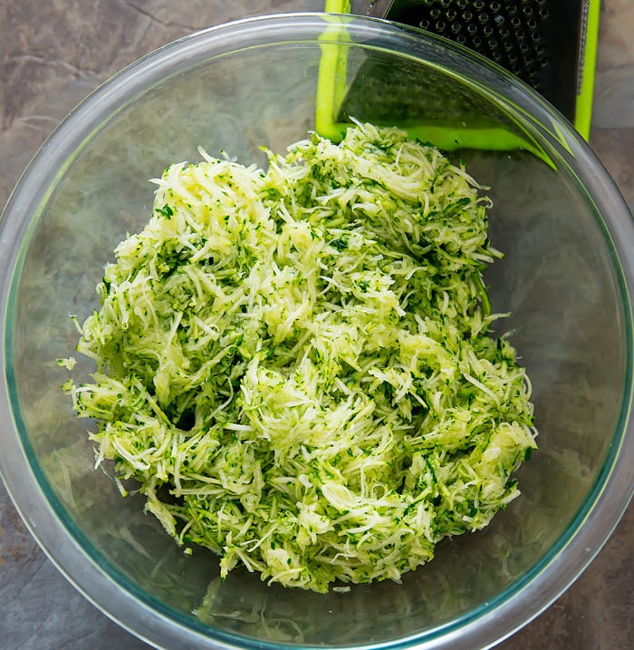 overhead photo of a bowl of shredded zucchini
