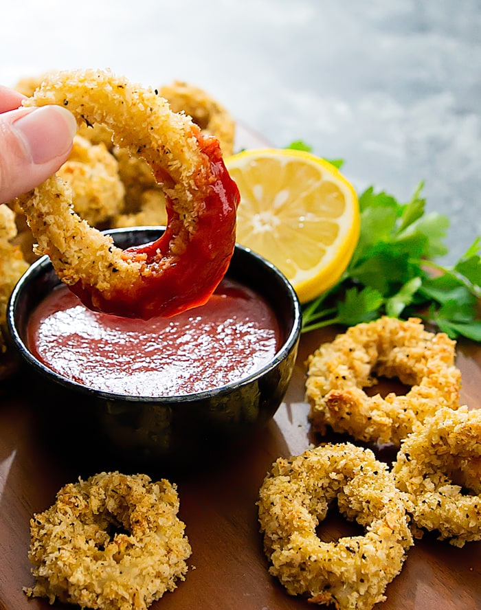 close-up photo of a squid ring dipped in sauce