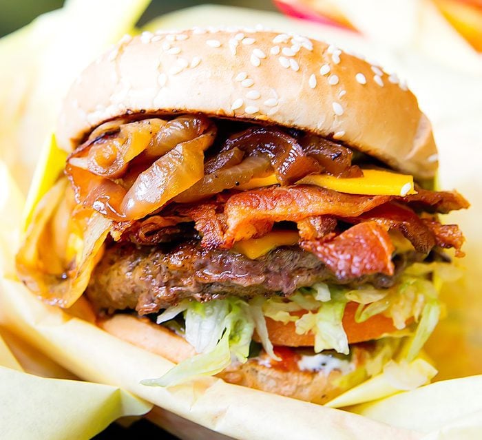 close-up photo of a cheeseburger with caramelized onions