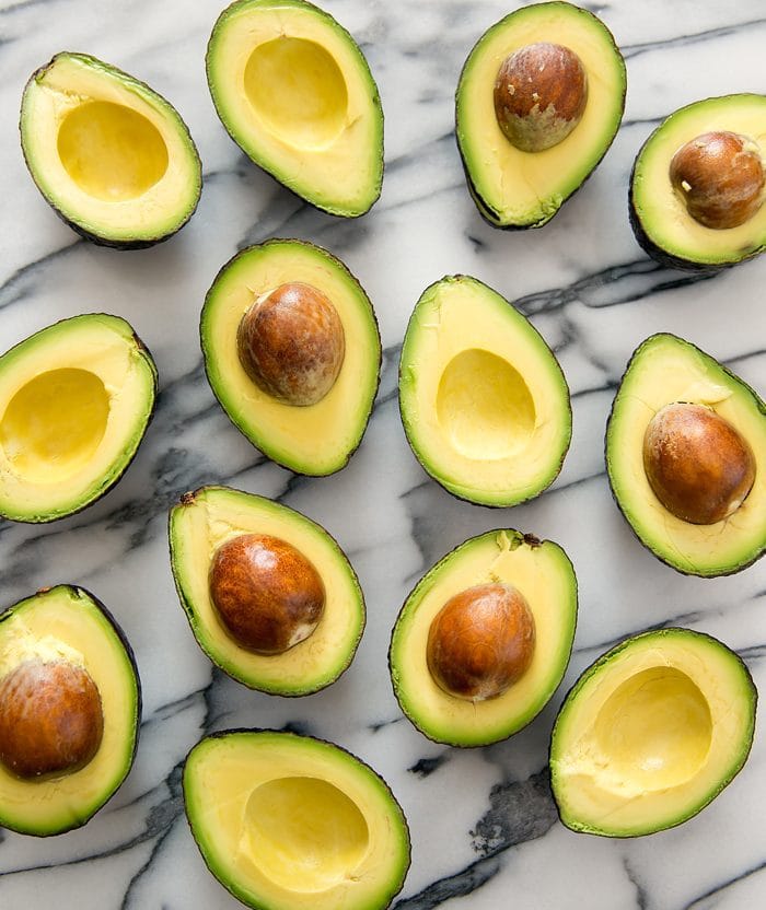 top down photo of avocados sliced in half