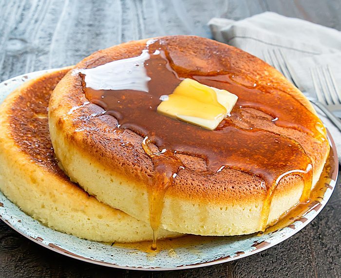photo of Giant Instant Pot Pancakes on a plate with butter and syrup