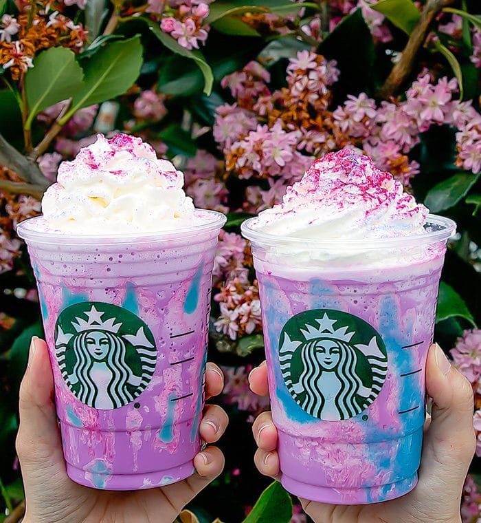 close-up photo of two Starbucks' Unicorn Frappuccino