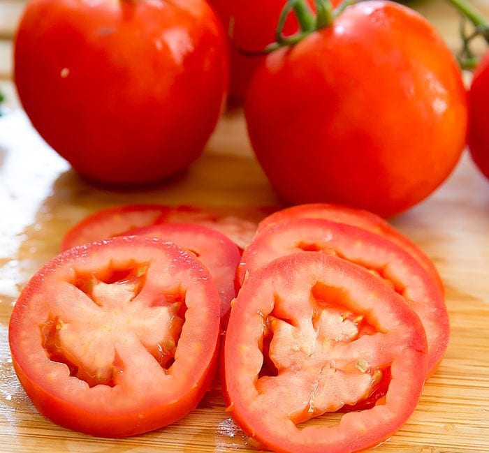 tomato slices on a cutting board