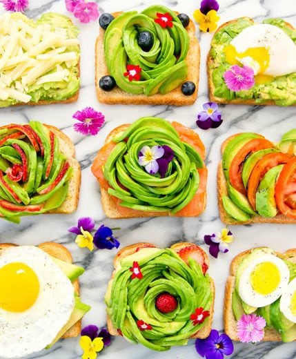 overhead photo of different kinds of avocado toasts