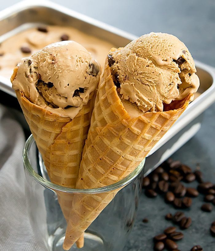 close-up photo of two ice cream cones with scoops of No Churn Espresso Chip Ice Cream