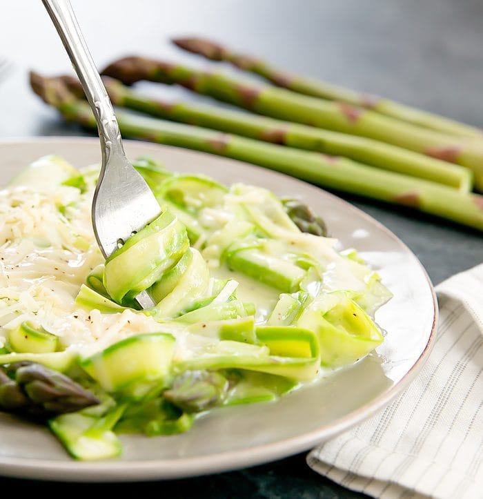 photo of a fork with Asparagus Noodles with Garlic Cream Sauce
