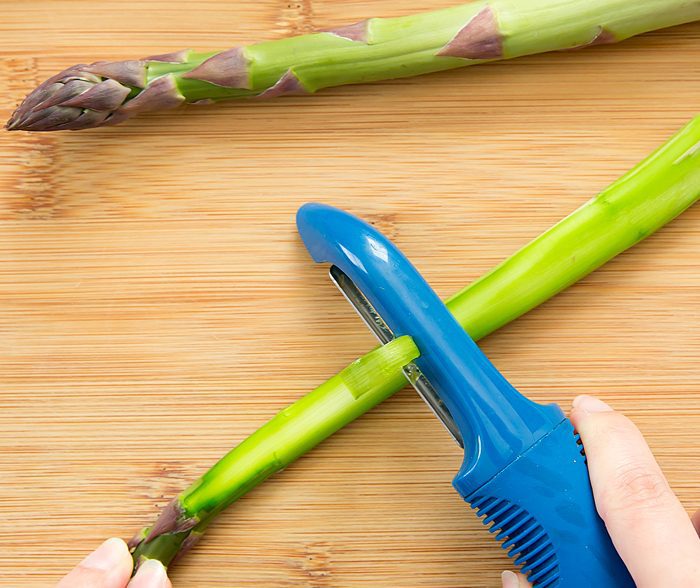 step by step photo showing how to shave the asparagus