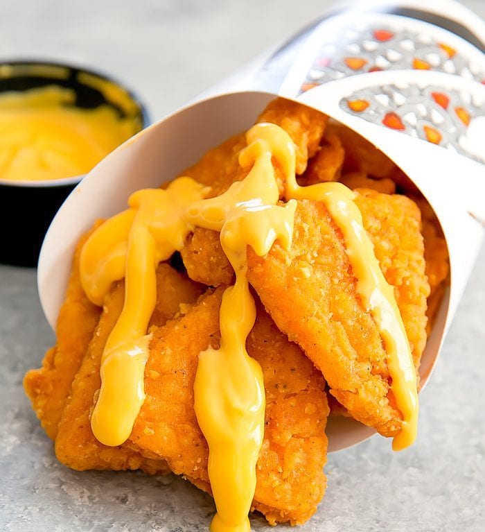 photo of Taco Bell's Naked Chicken Chips drizzled with Nacho Cheese