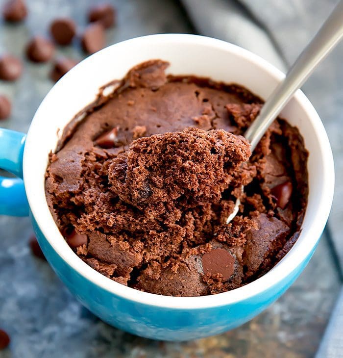 close-up photo of a spoon dipping into a chocolate mug cake