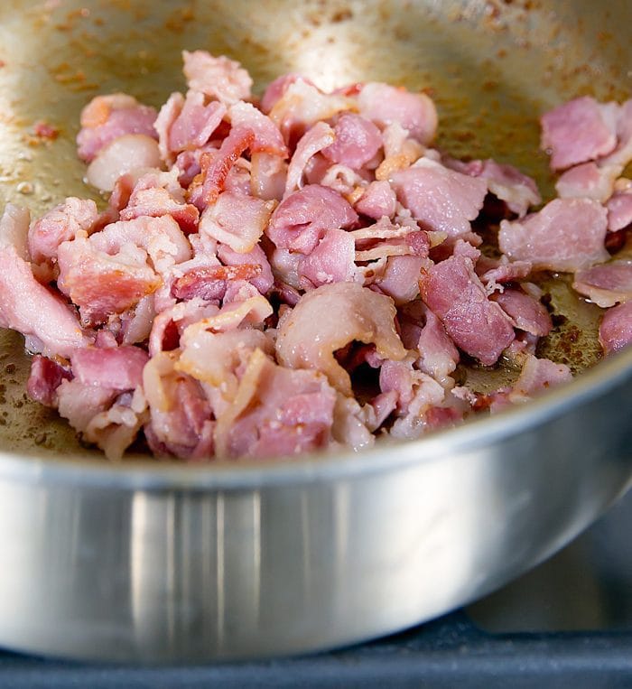 close-up photo of bacon cooking in a skillet