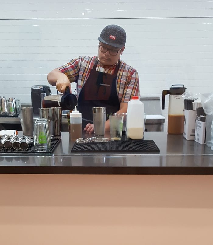 photo of an employee making drinks