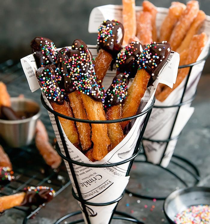 photo of chocolate-dipped Donut Fries in a paper cone