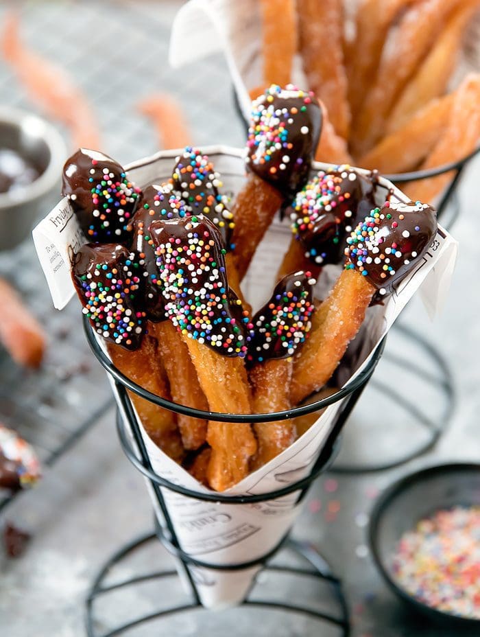 close-up photo of chocolate dipped donut fries