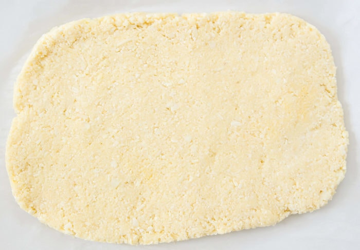 process photo showing how to form the cauliflower dough into a rectangle
