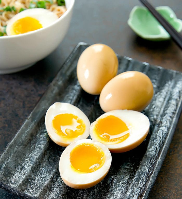 a close-up photo of marinated soft boiled eggs
