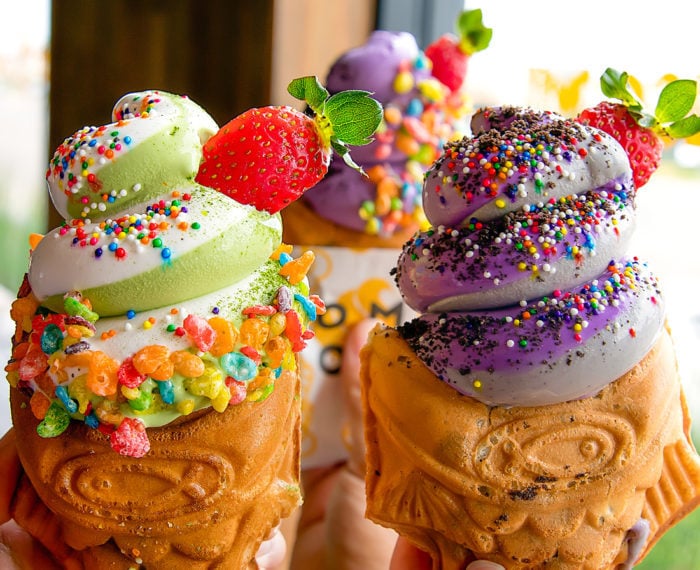 photo of matcha & milk, ube & black sesame ice cream cone and a ube ice cream cone