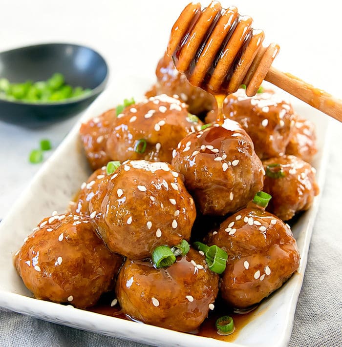 photo of honey being drizzled on meatballs