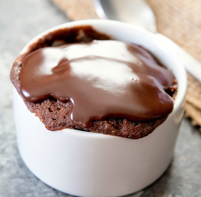 photo of Peanut Butter Nutella Brownie Mug Cake topped with chocolate ganache