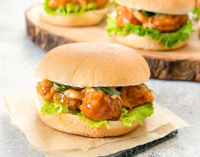 a close-up photo of general tso's chicken slider