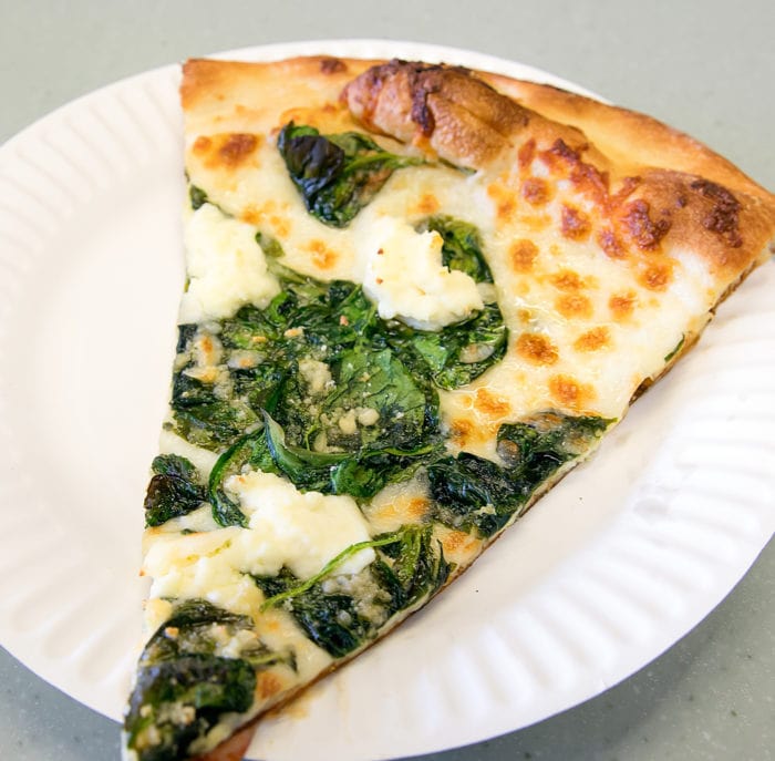 photo of  a slice of Spinach Ricotta Pizza