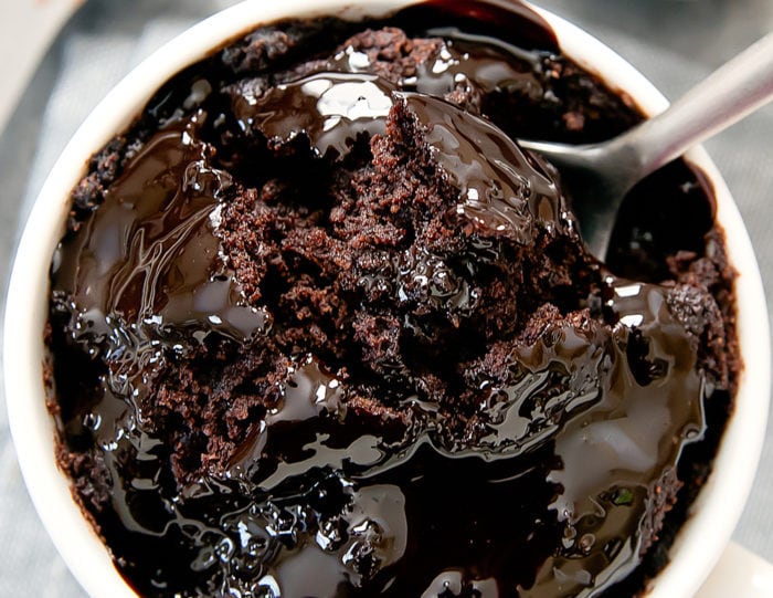 overhead photo of a spoon dipping into the mug cake