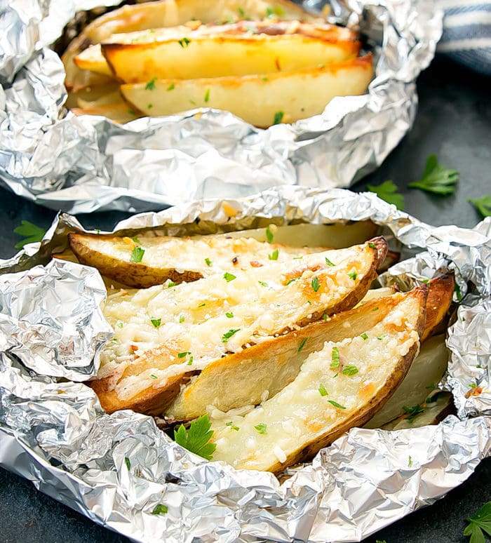 photo two foil packs of garlic fries