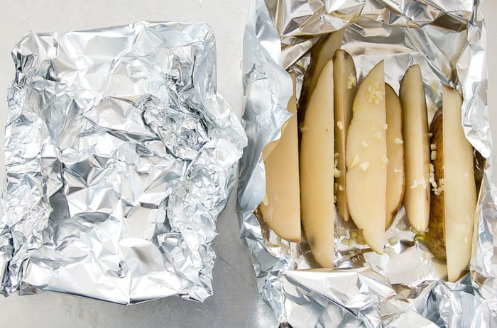 step by step photo showing how to wrap the potatoes in foil packs