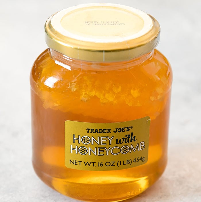 photo of a jar of Honey with Honeycomb