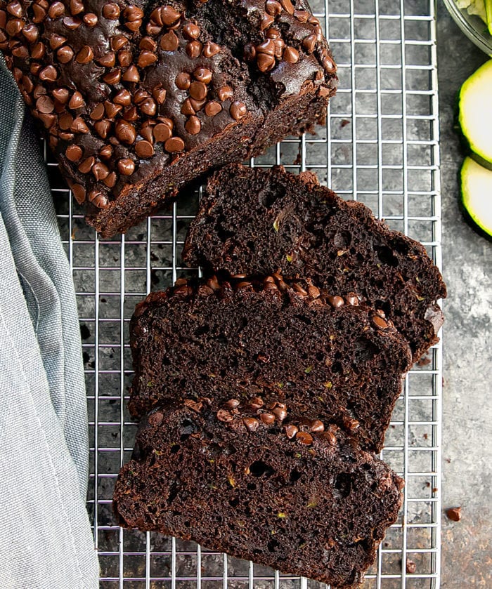 overhead photo of slices of chocolate zucchini bread on a baking rack