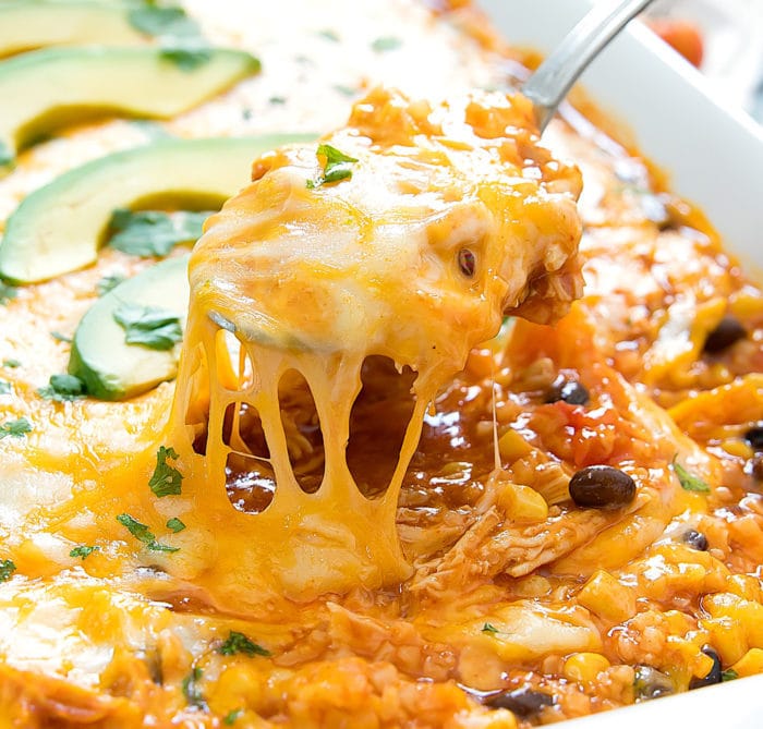 close-up photo of a spoonful of chicken enchilada cauliflower rice casserole