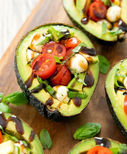 photo of a caprese stuffed avocado