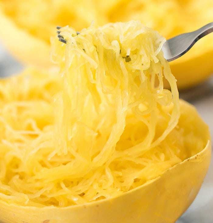close-up photo of a forkful of cooked spaghetti squash