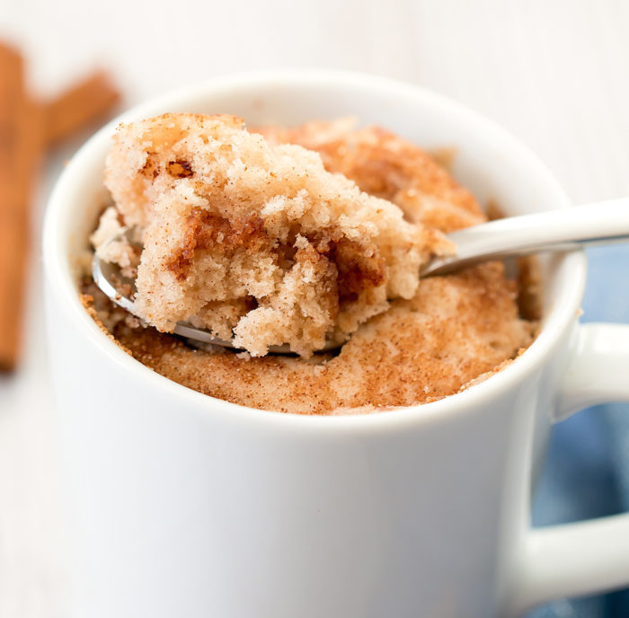 close-up photo of a spoon dipping into a snickerdoodle mug cake