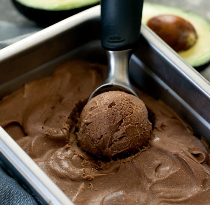photo of chocolate avocado ice being scooped out of a container
