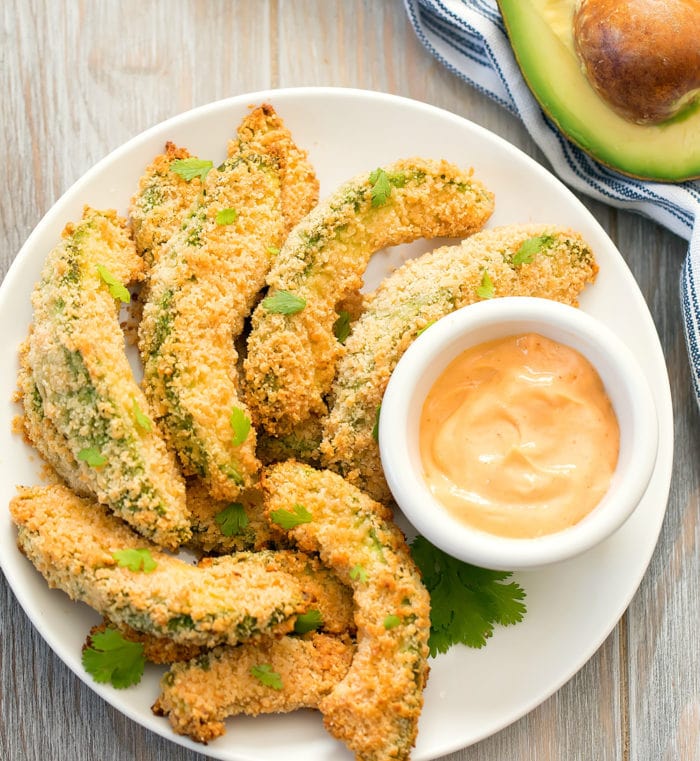 overhead photo of a plate of avocado fries with dipping sauce