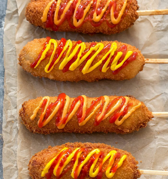 overhead photo of four korean hot dogs