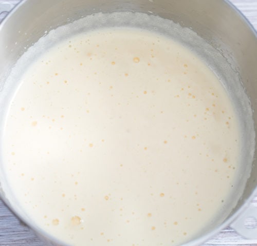 overhead photo of whipped egg whites in a bowl